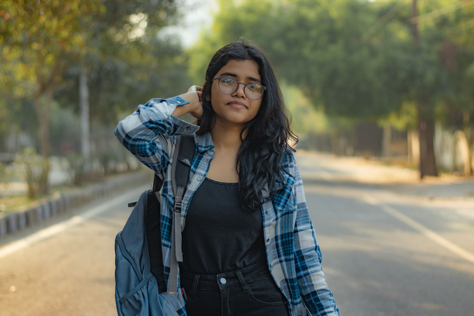Ananya Singh with her backpack on the road to college